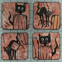 black cats in the pumpkin patch